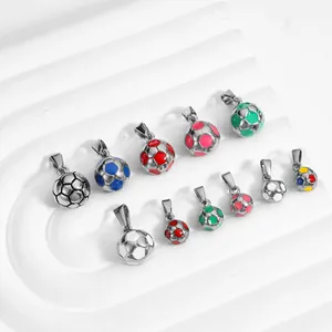 Stainless steel soccer ball pendants with colorful enamel finish on white tray.