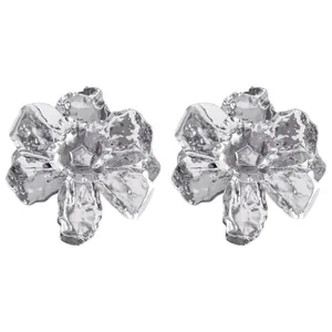 Detailed view of silver-tone hammered metal 3D flower earrings