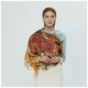 Detail view of a woman wearing a sunflower oil painting print shawl with tassels