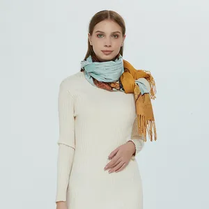 Elegant oil painting floral scarf with tassels worn by model on white background