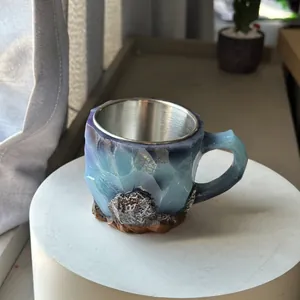 Close-up detail of 3D mineral crystal texture on a resin and stainless steel mug