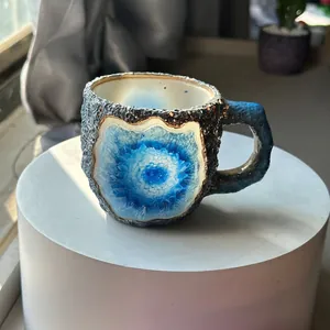 Macro view of a crystal-style resin coffee mug with blue geode design.