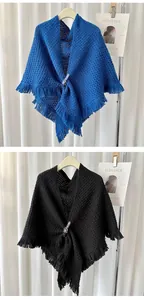Knit triangle shawl with leather buckle and fringe in classic blue and black colors