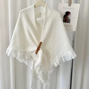 Elegant white triangular knit shawl scarf featuring fringe trim and leather buckle