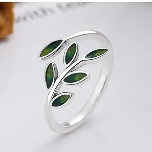 Detailed macro view of a 925 silver nature-inspired leaf ring with green enamel