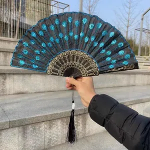 Detail view of Chinese folding fan featuring blue sequin embroidery on black fabric