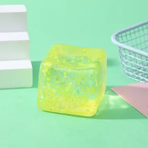 Macro view of a yellow glittery slow rebound water cube TPR stress relief squeeze toy