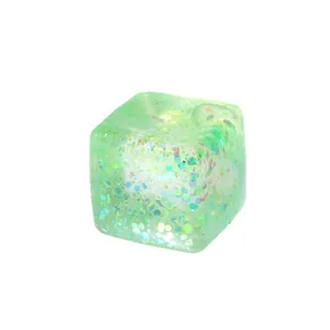 Translucent green glitter cube squishy toy for stress relief and sensory fidget play