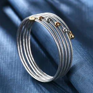 Bracelet jonc multicouche en fil d'acier tressé avec perles bicolores et or