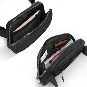 Interior view of black waterproof nylon waist bag showing multiple card slots and phone pocket