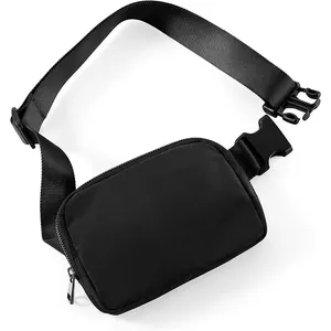 Minimalist black waterproof nylon waist bag with adjustable strap for outdoor sports.