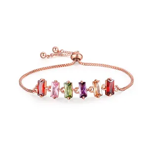Adjustable rose gold bolo bracelet with multi-colored rectangular zircon stones.
