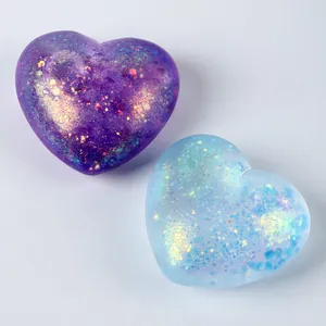 Macro detail of translucent heart-shaped squishy toys filled with colorful glitter particles