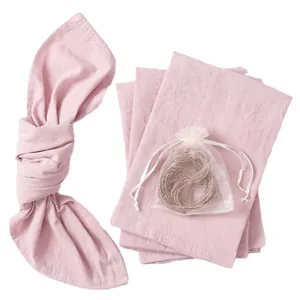 Set of soft pink cotton linen cloth napkins with decorative twine for party table decor
