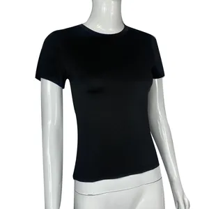 Detail view of a slim-fit black short-sleeved t-shirt displayed on a white mannequin