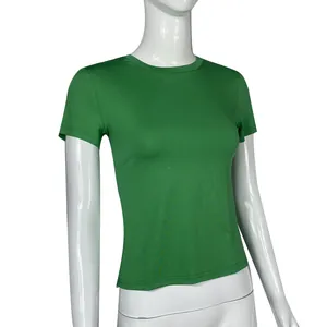 Close-up view of a women's solid green short-sleeved t-shirt on a white mannequin.