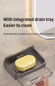 Wall-mounted gray soap dish detail showing the convenient pull-out transparent drainage tray