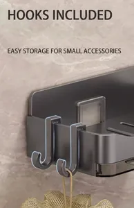 Close-up of functional hooks on a gray wall-mounted soap dish for bathroom organization