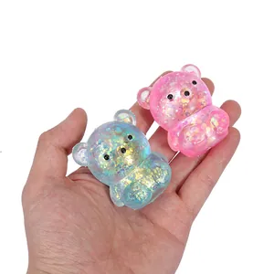 Sparkling glitter bear squishy decompression toy for stress relief in pink and blue colors