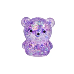 Macro view of purple glitter bear squishy toy showing shiny flakes and transparent texture