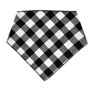 Detailed macro view of black and white buffalo plaid pet bandana with soft fleece fabric