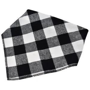 Detail view of black and white buffalo plaid pet bandana scarf with soft texture.