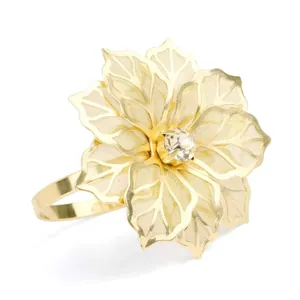 Luxury gold filigree flower napkin ring with crystal center on white background