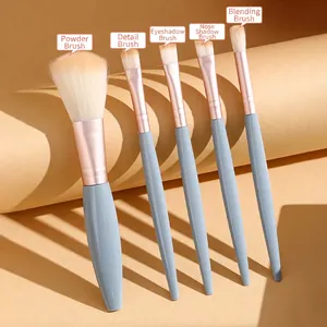 Portable 5-piece mini makeup brush set with blue handles and rose gold ferrules