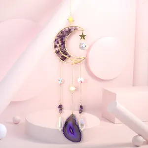 Close-up of gold moon suncatcher with purple amethyst chips and agate slice pendant