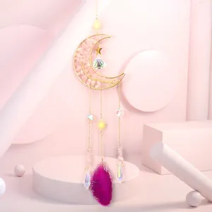 Moon-shaped suncatcher with tree of life design and vibrant fuchsia agate slice