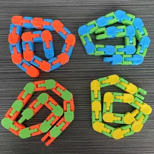Four colorful articulated wacky tracks fidget chains arranged on a dark grey background.