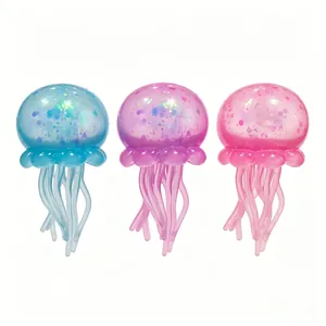 Close-up of three glittery jellyfish sensory stress relief toys in blue, purple, and pink.