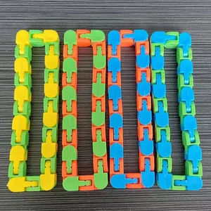 Macro view of four colorful 24-section fidget click tracks in various color combinations.