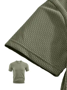 Close-up of olive green waffle texture on men's athletic T-shirt showing sleeve detail.