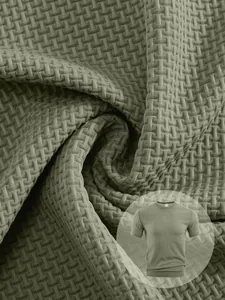 Macro view of breathable waffle texture fabric on men's green sports T-shirt
