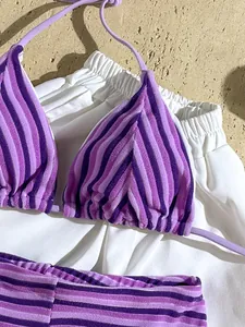 Macro view of purple striped terry cloth bikini fabric showing soft towel-like texture