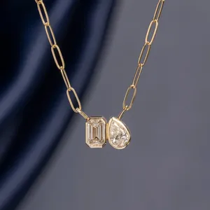 Gold-plated paperclip chain necklace featuring emerald and pear cut zircon stones