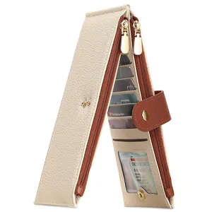 Detailed macro view of a beige pebble leather multi-card wallet with golden double zippers