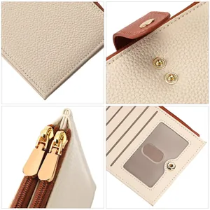Detailed view of leather texture, gold zippers, and card slots of women's wallet