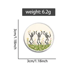 Vintage pastoral enamel pin featuring three dancing skeletons and small flowers
