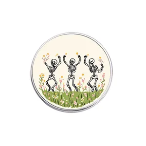 Vintage circular enamel pin featuring three skeletons dancing in a field of colorful flowers.