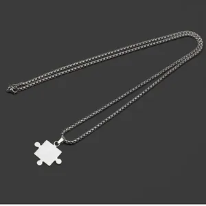 Elegant minimalist stainless steel puzzle piece pendant necklace with silver box chain