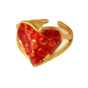 Gold stainless steel open ring with a red embossed flower heart centerpiece.