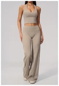 Beige yoga set with halter top and high-waisted wide-leg sports pants for women