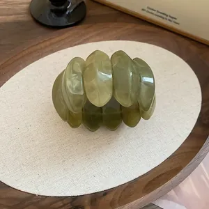 Green marbled acrylic oval chunky segmented bracelet in a high-end fashion variant view
