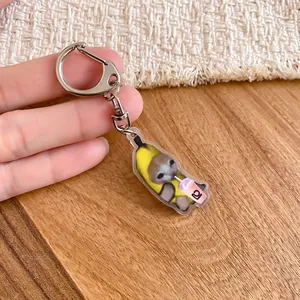 Adorable Banana Cat meme acrylic charm keychain variant featuring a cute cat in a fruit suit