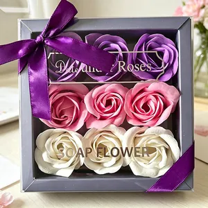 Detailed view of 9-rose soap flower gift box in purple, pink and white with ribbon bow