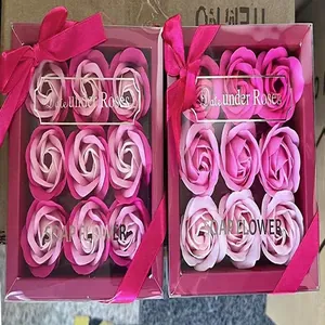 Close-up view of elegant rose soap flower gift boxes featuring decorative pink ribbons