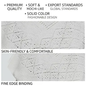 White hollow knit shawl with intricate diamond pattern and fine edge binding