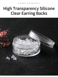 Close-up of clear silicone earring backs in a small transparent round storage jar.